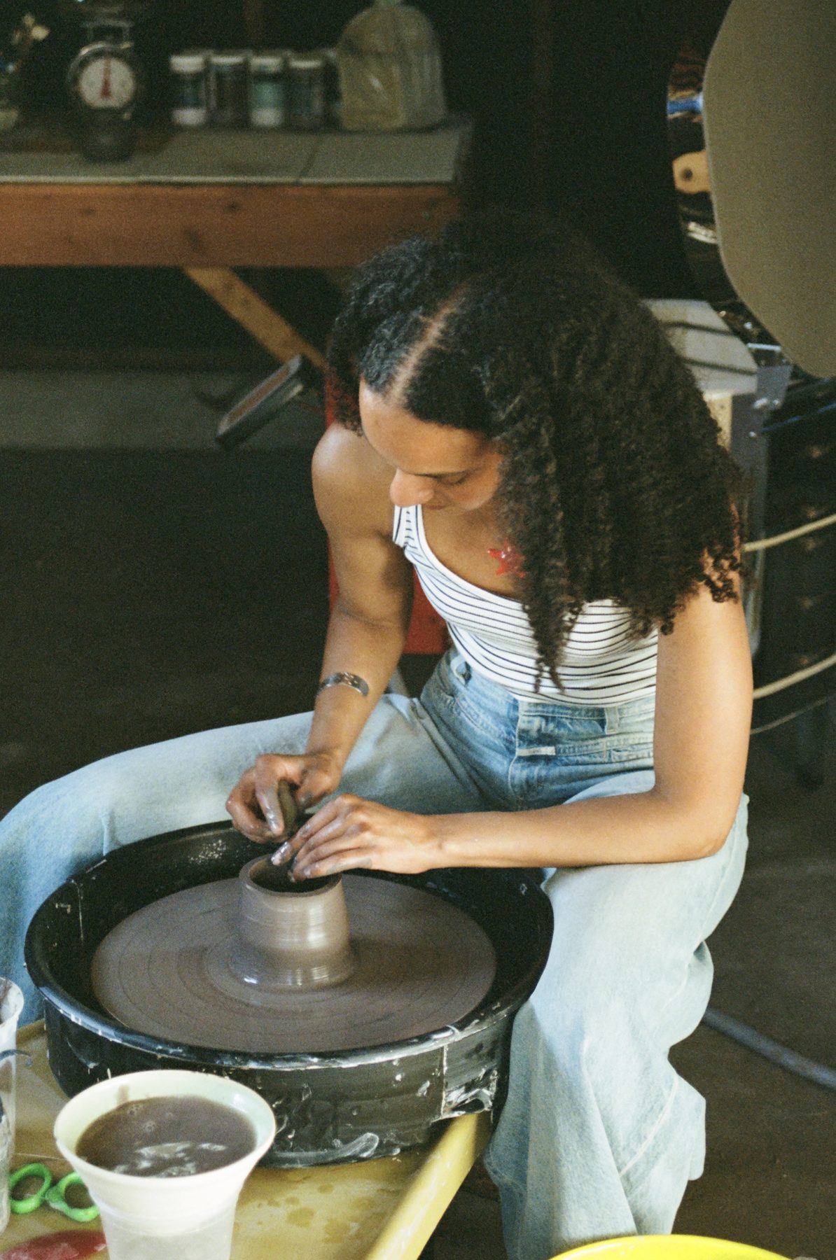 Throwing a cup on the wheel