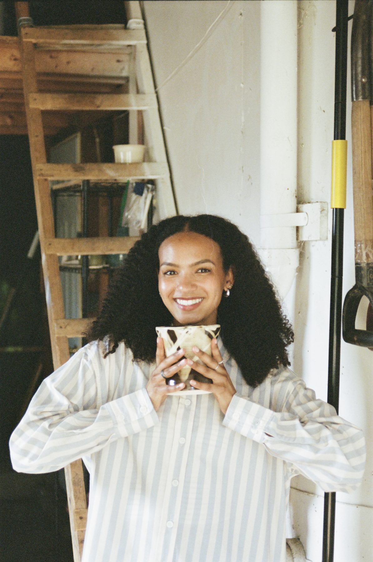 Maeleisa smiling with a finished piece